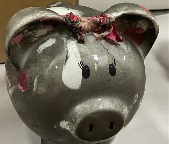 Soot covered piggy bank