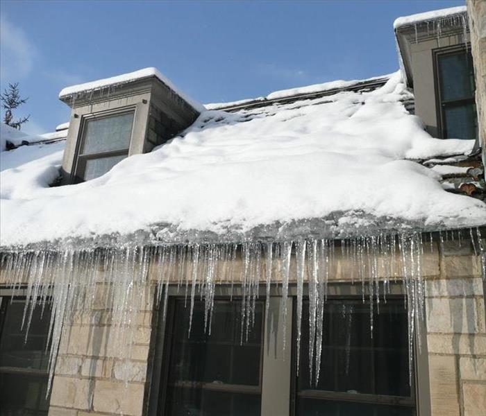 A roof damaged by ice dams