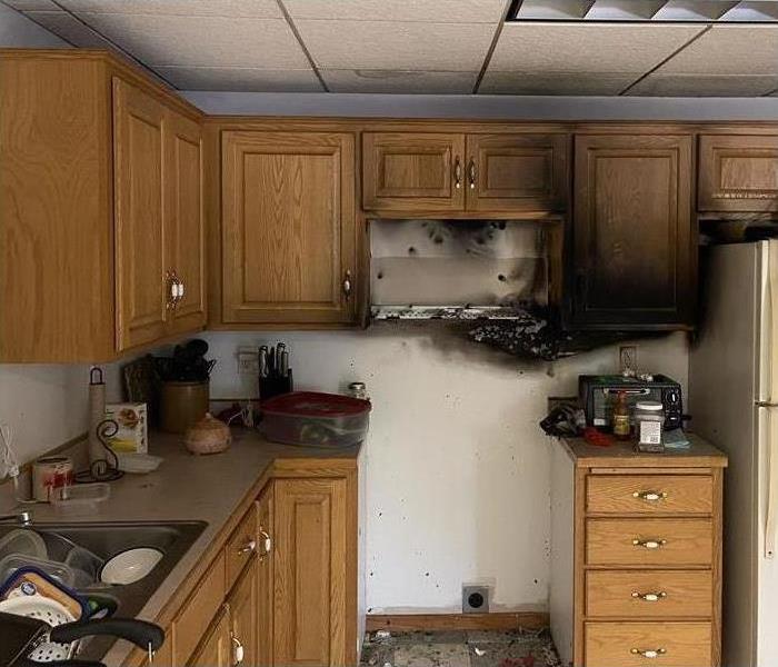 Kitchen fire, burned kitchen cabinets