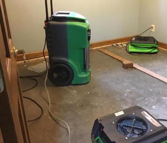 Lower level water damage, equipment in place to dry